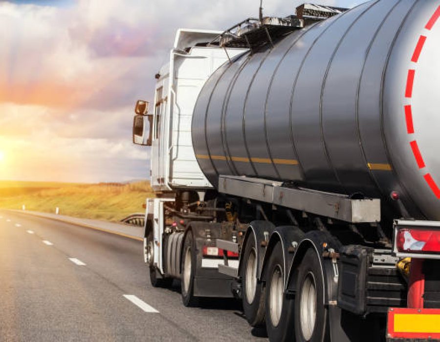 Big gas-tank goes on highway against the sky